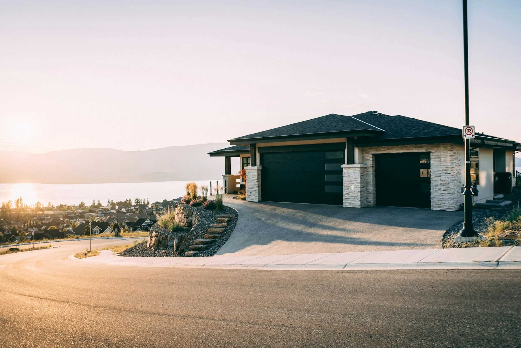 Contemporary home with a double and single sectional garage door